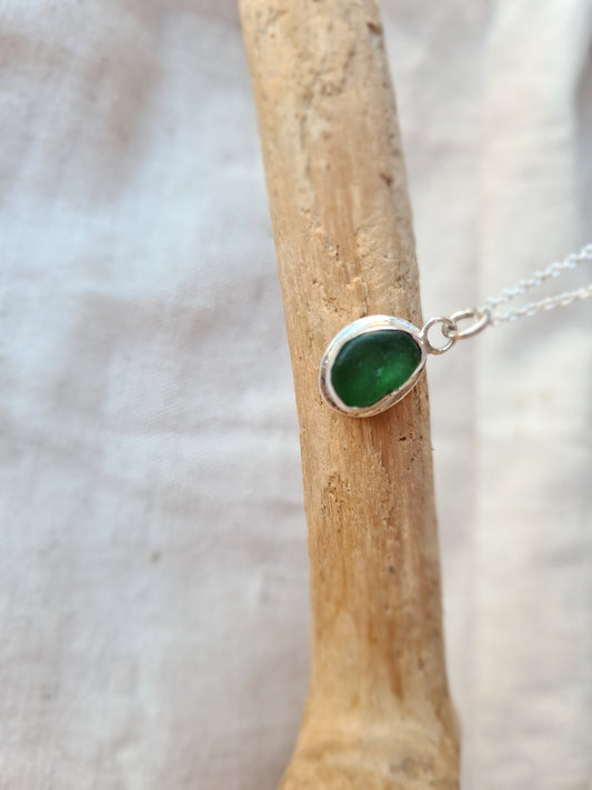 This little green sea gem is nestled in a sterling silver bezel on a delicate silver cable chain. Made with sustainability in mind this handmade silver necklace is made from 100% recycled silver.