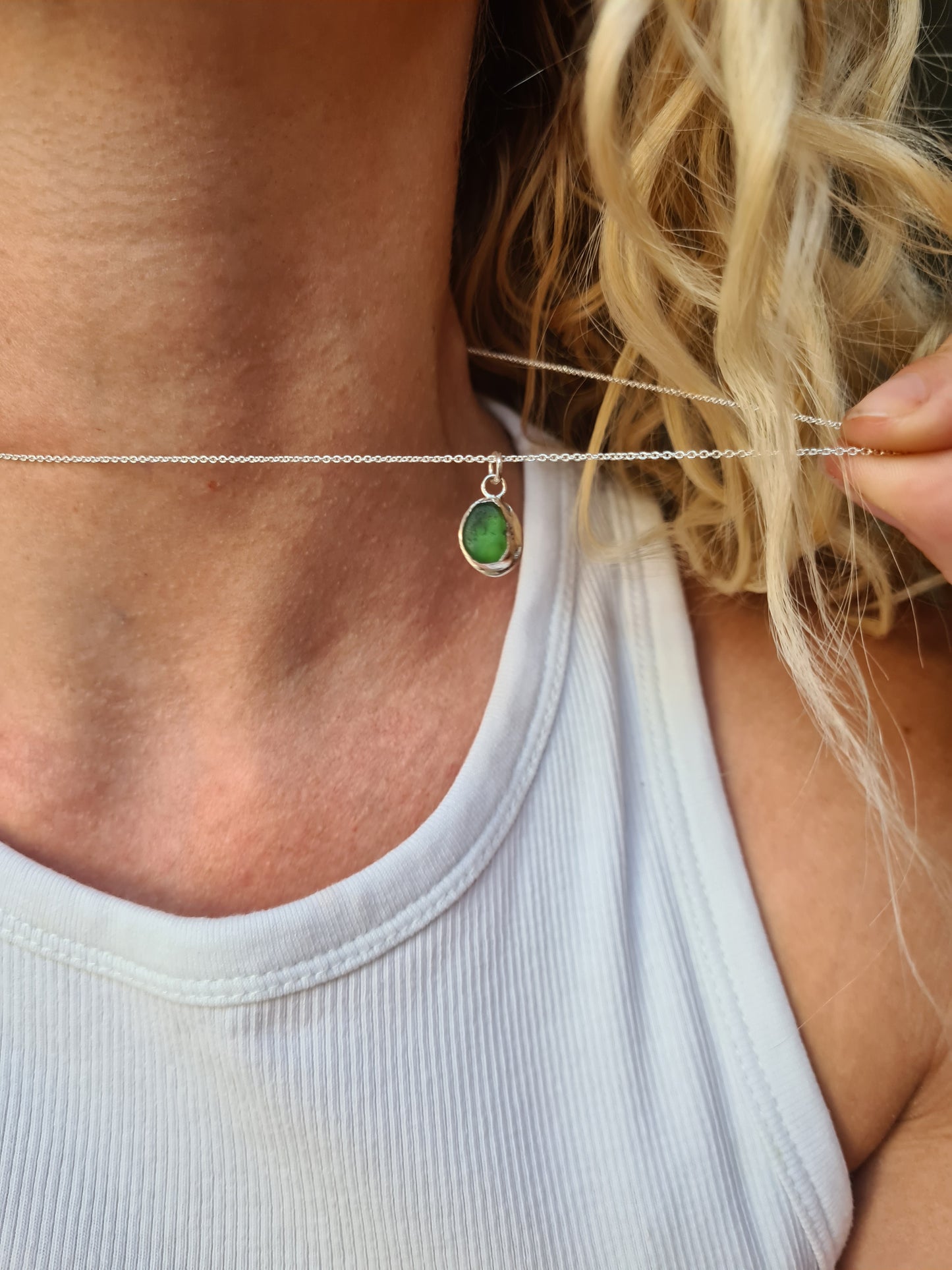 This little green sea gem is nestled in a sterling silver bezel on a delicate silver cable chain. Made with sustainability in mind this handmade silver necklace is made from 100% recycled silver.