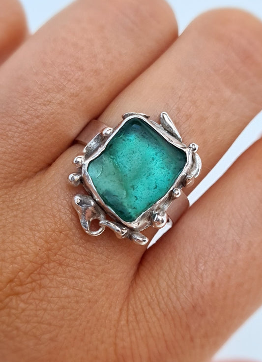This unique ring is inspired by the organic shapes found in the sea. The captivating turquoise sea gem is nestled in a sterling silver bezel set upon a thick band. Crafted with sustainability in mind this handmade silver ring is made from 100% recycled silver.