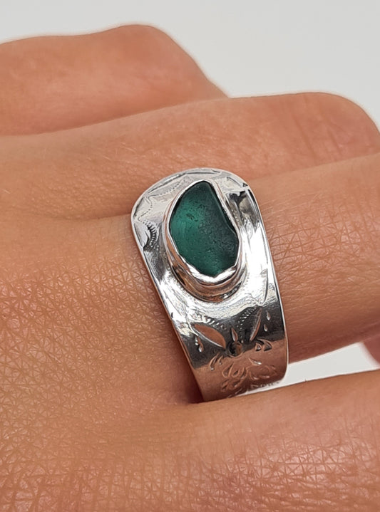 This beautiful teal sea gem is nestled in a silver bezel set upon a reworked vintage sterling silver spoon with intricate details. Crafted with sustainability in mind this silver ring is handmade from 100% recycled silver.