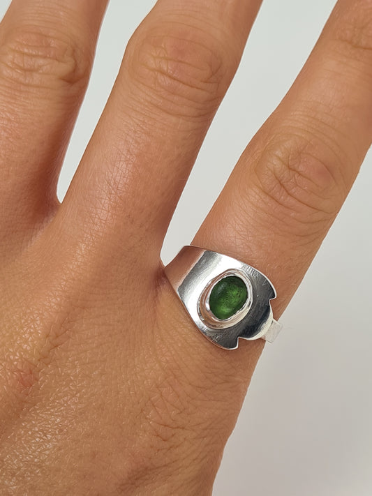 This bright round green sea gem is nestled in a silver bezel set upon a reworked vintage sterling silver spoon. Made with sustainability in mind this handmade silver ring is made from 100% recycled silver.