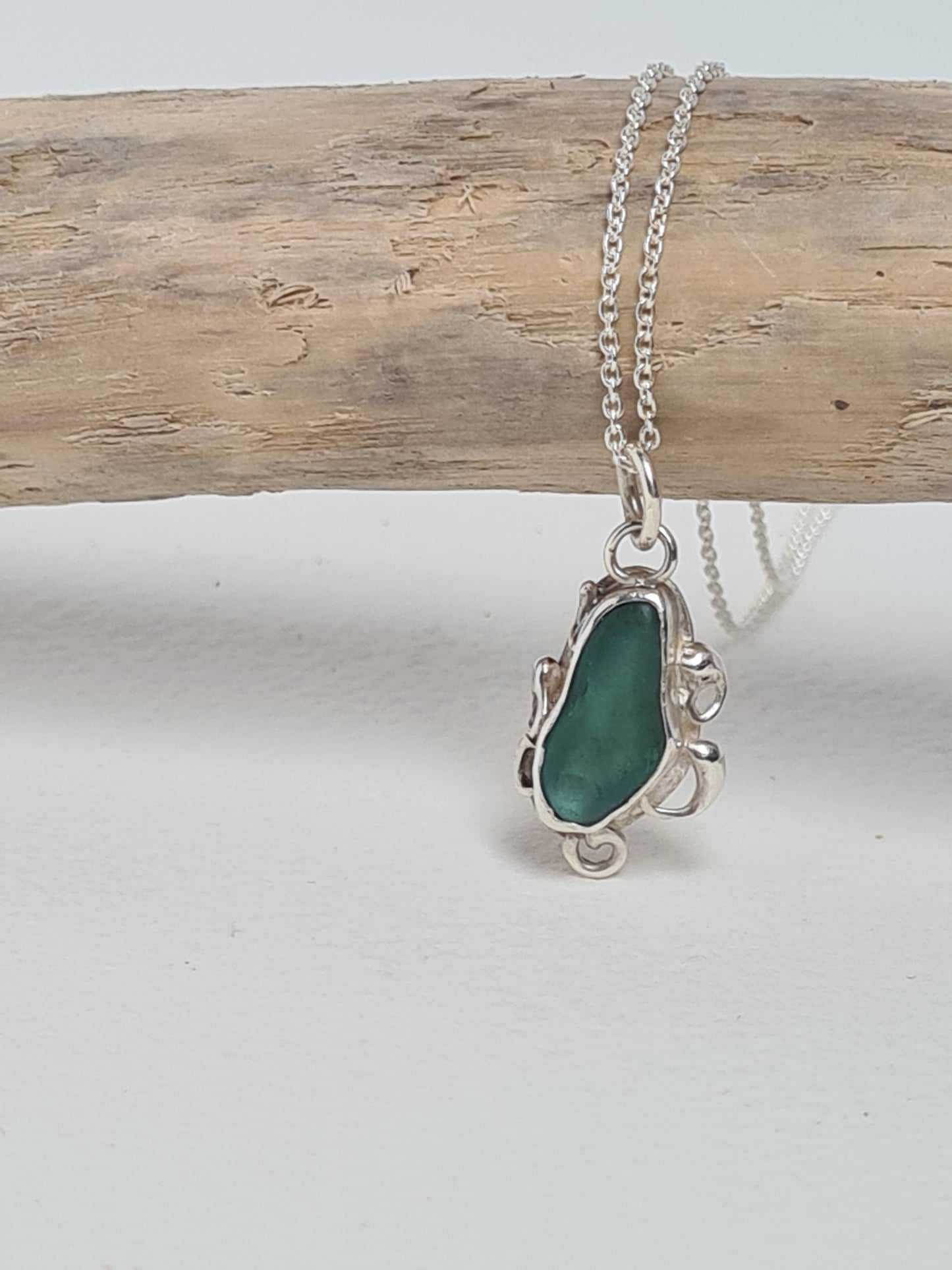 This unique pendant is inspired by the organic shapes found in the sea. The aquamarine sea gem is nestled in a sterling silver bezel on a delicate silver cable chain. Handmade with sustainability in mind this necklace is made from 100% recycled silver.