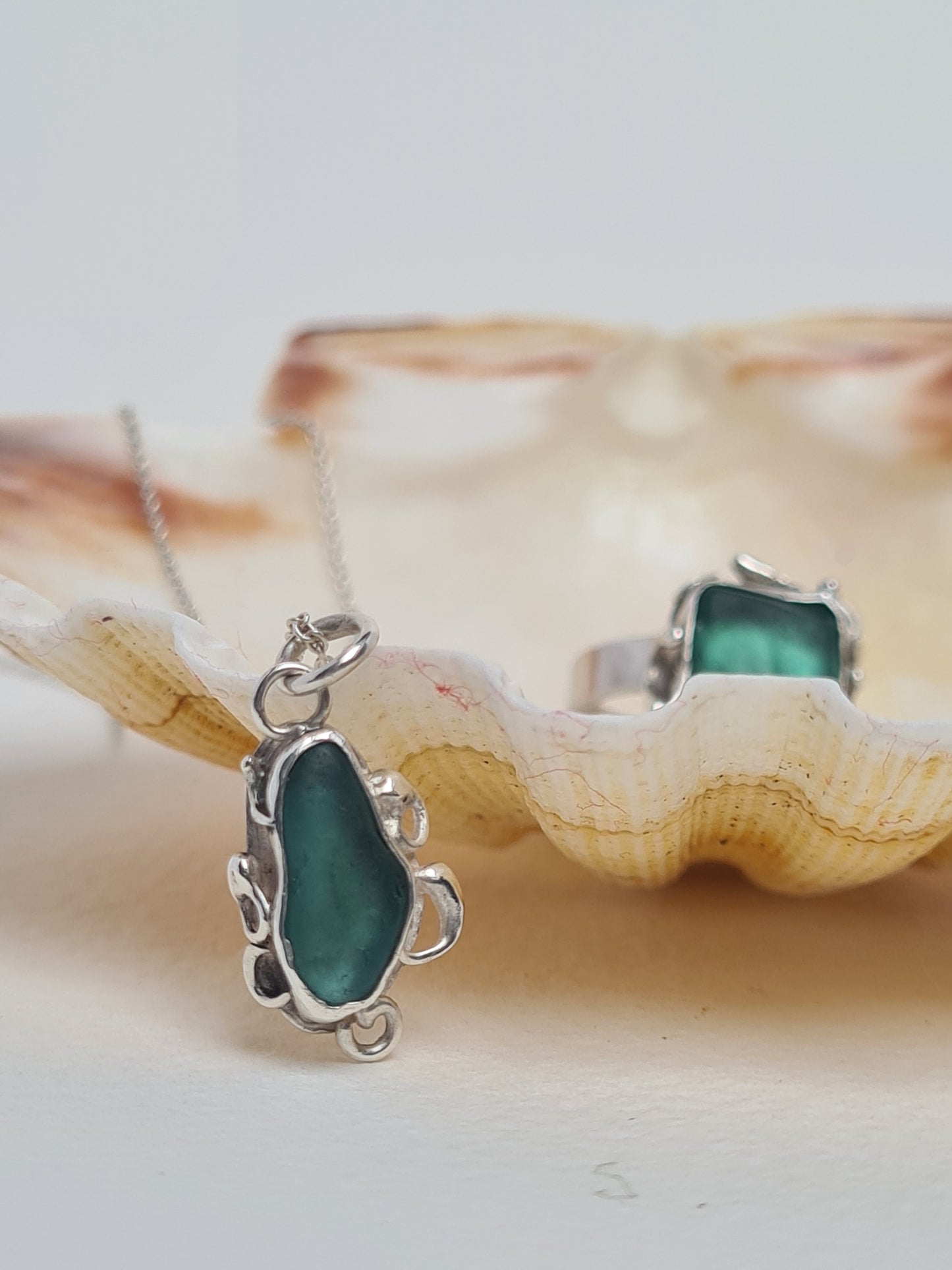 This unique pendant is inspired by the organic shapes found in the sea. The aquamarine sea gem is nestled in a sterling silver bezel on a delicate silver cable chain. Handmade with sustainability in mind this necklace is made from 100% recycled silver.