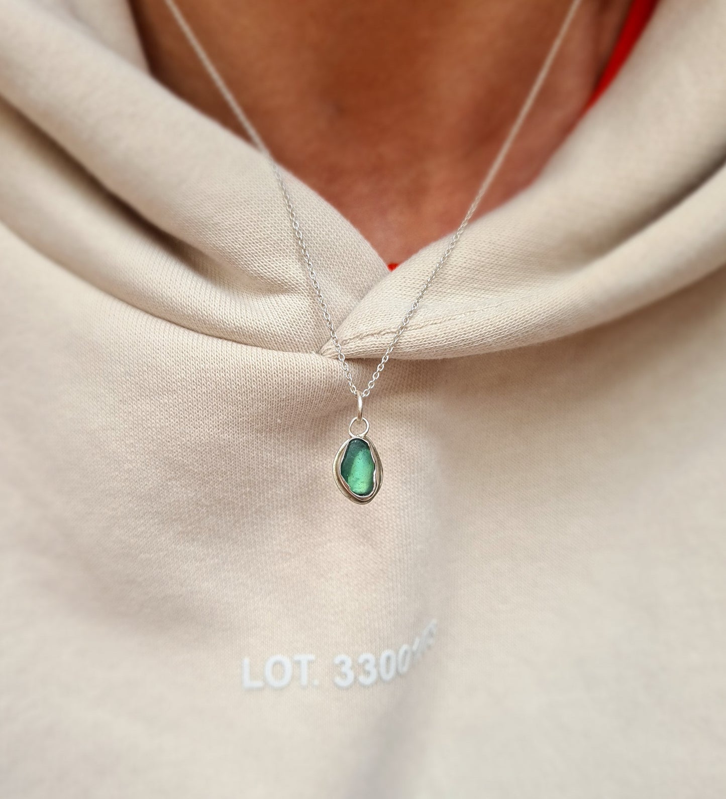 This little aquamarine sea gem is nestled in a sterling silver bezel on a delicate silver cable chain. Handmade with sustainability in mind this silver necklace is made from 100% recycled silver.