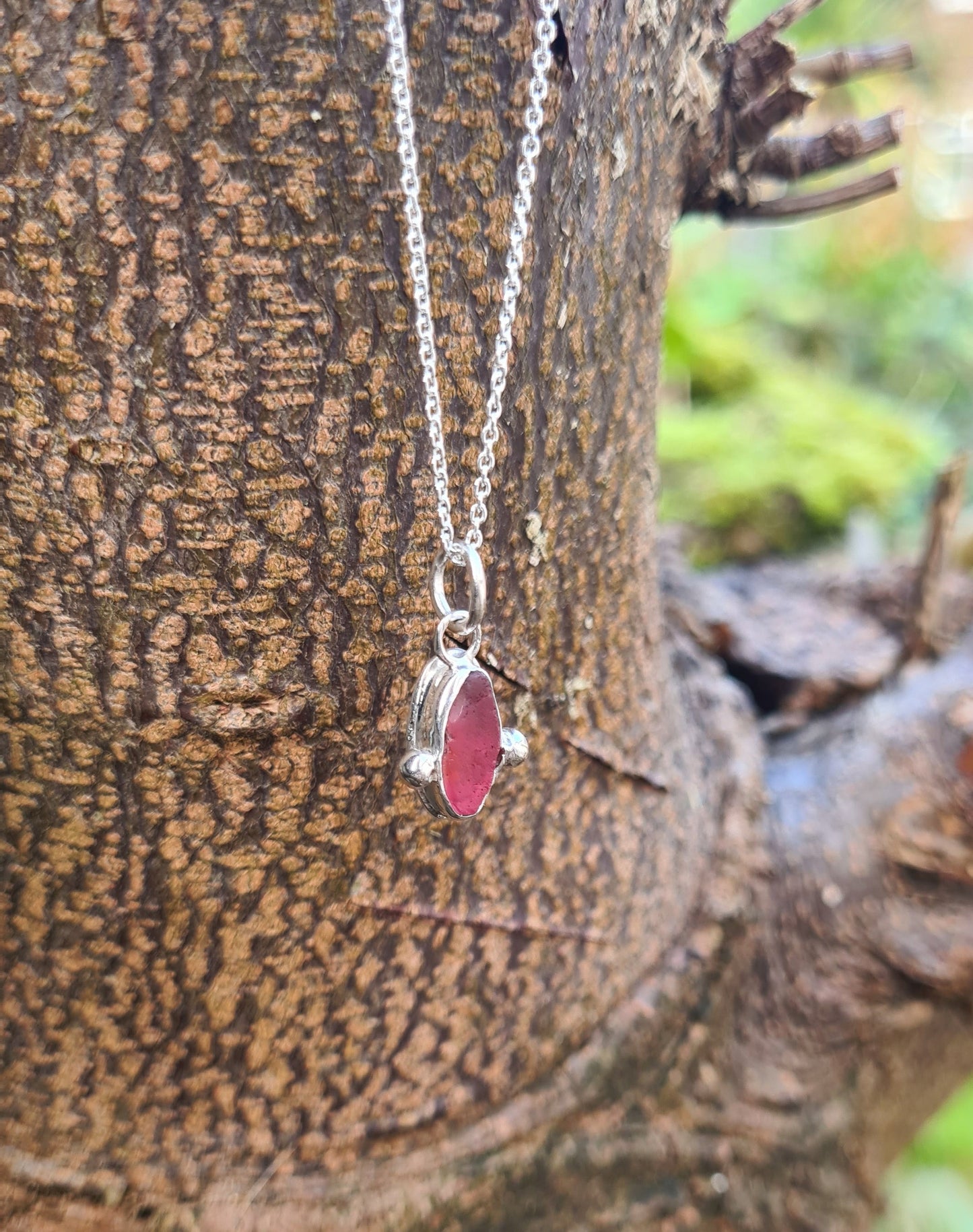 This extremely rare piece of pink sea glass is nestled in a sterling silver bezel on a delicate silver cable chain. Handmade with sustainability in mind this silver necklace is made from 100% recycled silver. This piece of sea glass was found in West Cork, Ireland. A fragment of our beloved Irish coastline forever preserved in silver.