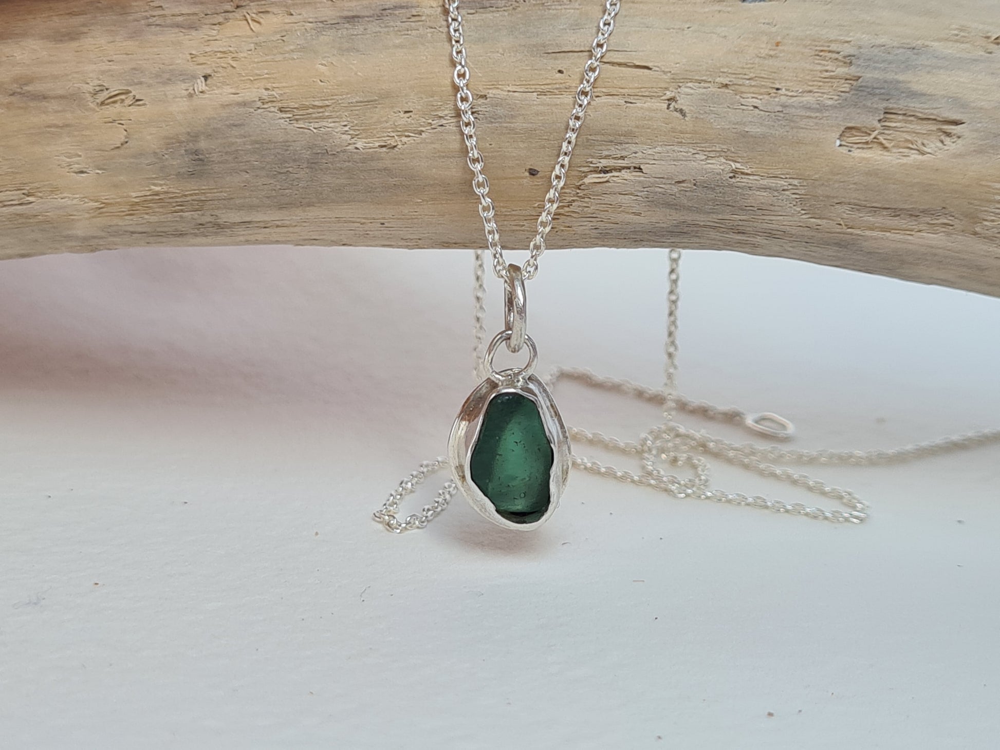 This little aquamarine sea gem is nestled in a sterling silver bezel on a delicate silver cable chain. Handmade with sustainability in mind this silver necklace is made from 100% recycled silver.