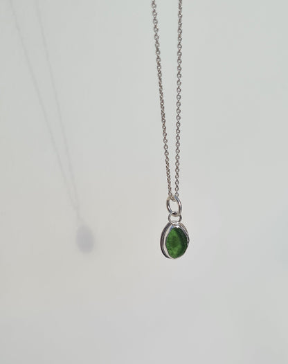 This bright little green piece of sea glass is nestled in a sterling silver bezel on a delicate silver cable chain. Handmade with sustainability in mind this silver necklace is made from 100% recycled silver.  This piece of sea glass was found in West Cork, Ireland. A fragment of our beloved Irish coastline forever preserved in silver. 